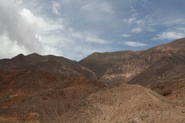 Geology. Desolated landscape. The brown and arid mountains under a beautiful sky.  