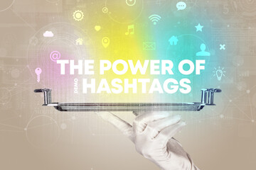 Waiter serving social networking with THE POWER OF #HASHTAGS inscription, new media concept