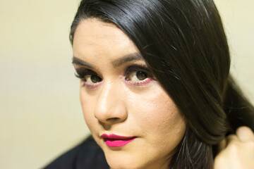 Latin woman with professional makeup with eye shadows