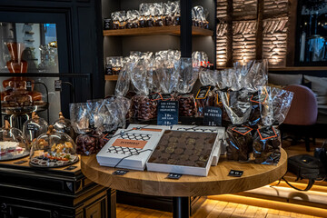 Bayonne, France. 29.06.2020. Chocolate boutique handmade on dark background. Handmade style....