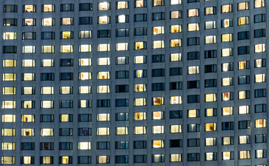 Fototapeta na wymiar Hotel windows at night. Travel concept for big luxury hotel chain.