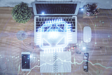 Double exposure of data theme drawing hologram over topview work table background with computer. Concept of technology.