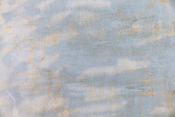 Light blue painted cracked weathered rusty background.