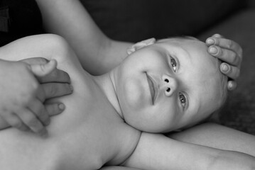 Mom with her little son have a good time at home.