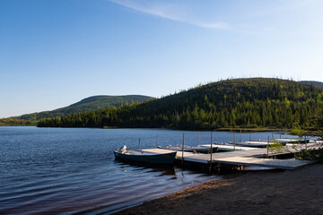 Rowing boats tied up at the quay of the Arthabaska lake, in the Grands-jardins national park, Canada