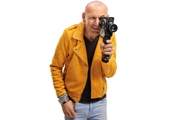 Bald hipster guy filming with a vitnage camera recorder