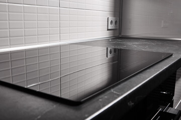 Modern electric cooker surface in the kitchen for cooking close up