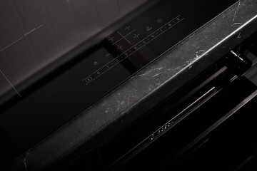 New electric induction cooker close-up. Kitchen black and white interior