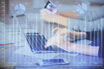 Multi exposure of woman hands typing on computer and financial chart hologram drawing. Stock market analysis concept.