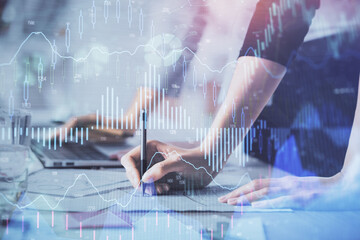 Multi exposure of woman hands typing on computer and financial chart hologram drawing. Stock market analysis concept.