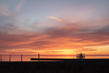 Colorful beach sunrise with clouds