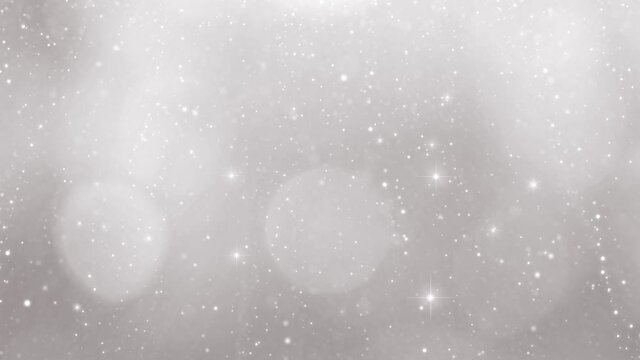 Bright silver Christmas and new year holiday sky decoration background with sparkles and blurry snowflakes animation. Copy space.