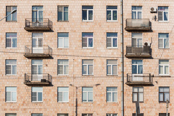 Old residential building exterior, full frame. Soviet multistorey house of Khrushchev time in St....
