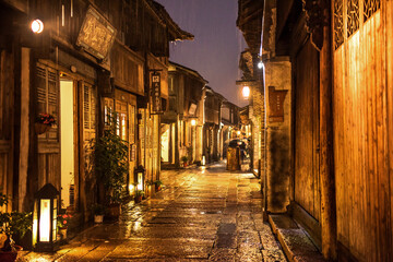 Fototapeta na wymiar Wuzhen,Tongxiang city,Zhejiang province,Chine. The night view of ancient town,Wuzhen, is a famous historical,cultural and traditional water town.