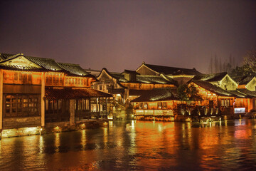 Fototapeta premium Wuzhen,Tongxiang city,Zhejiang province,Chine. The night view of ancient town,Wuzhen, is a famous historical,cultural and traditional water town.