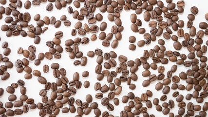 Coffee beans close-up,on a white background,top view,ripe bean beans collected on a plantation.
