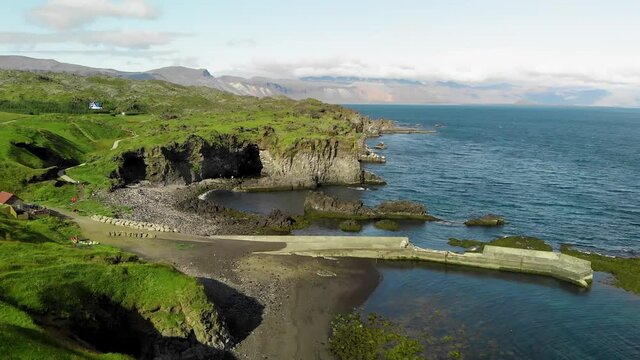 Arnarstapi coastline in sumemr season, Snaefellsnes peninsula, Iceland. Aerial view from drone