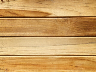 Four finished polished wooden planks placed horizontally