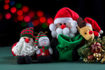 Christmas plush dolls with Christmas bokeh background