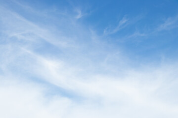 Clear blue sky with white cloud background