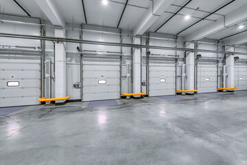 Loading gates of a large industrial warehouse. Industrial interior