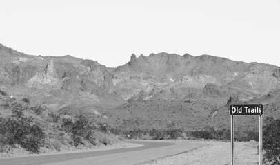 Ghost Town of Old Trails Sign on Route 66 in the Sonoran Desert, Arizona USA in Black and White