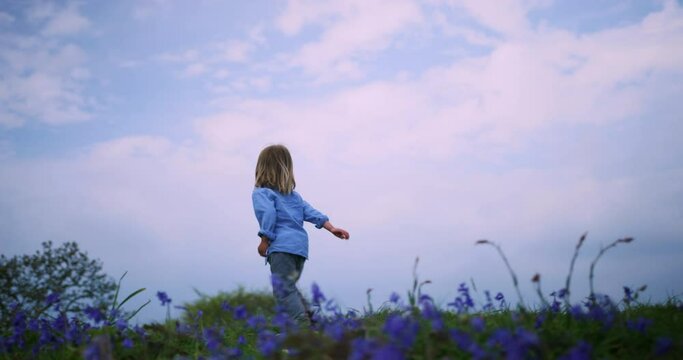 Little boy running in a meadow