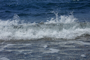 Fototapeta premium Beach waves macro background peristeres crete island covid-19 season modern high quality prints