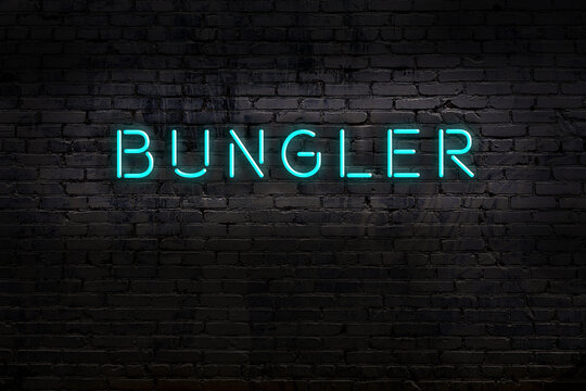 Night view of neon sign on brick wall with inscription bungler