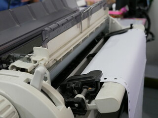 closeup of continuous paper printer in the office.