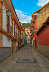 Vertical photograph of the beautiful Jaen street with its colorful Spanish colonial architecture in...