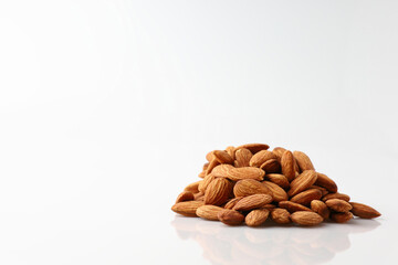 Natural organic almonds nuts heap Isolated on a white background is useful to help neutralize free radicals, help prevent Alzheimer's disease, helping repair the wear and tear on body healthy food.