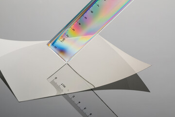 close up of ruler and his reflection  shadow with polarized light.