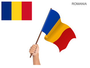 Country flag of Romania hoisted with a stick held by hand to inflame the spirit of statehood