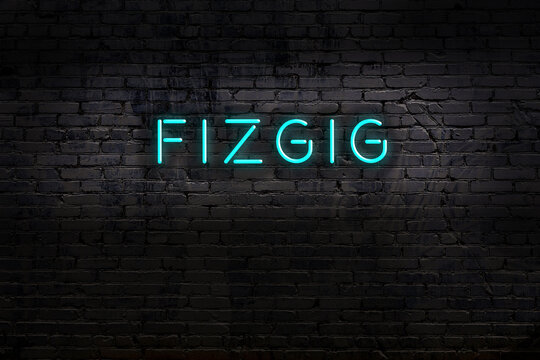 Neon sign. Word fizgig against brick wall. Night view
