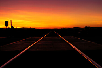 Fototapeta na wymiar Wild Wild West Railway Textured Background sunset in Karijini Western Australia