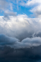 Naklejka na ściany i meble Scenery dramatic thunderstorm clouds with blue sky background. Natural weather landscape