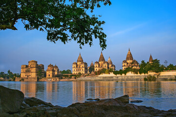 View of Royal cenotaphs (Chhatris) of Orchha over Betwa river. Orchha, Madhya Pradesh, India.