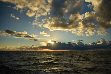 Epic cloud cover over the Pacific Ocean. Photo from the side of the ship. Autumn windy evening.