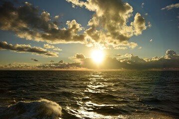 Epic cloud cover over the Pacific Ocean. Photo from the side of the ship. Autumn windy evening.