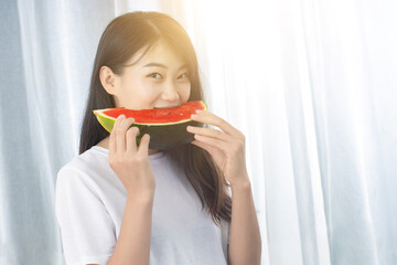 Hot summer young beautiful girls in the room to eat watermelon heat