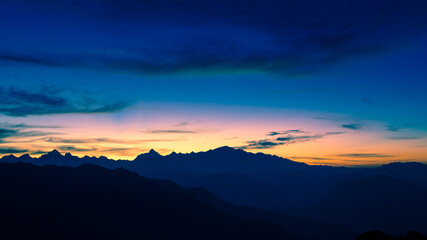 Beautiful panoramic landscape view of the sunrise of Himalayan snow mountains from Chandrashila peak in Chopta, Uttarakhand, India,.