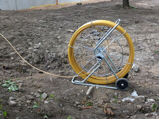 Cable laying tools. Fiberglass Wire Cable Snake Electric Reel Running Rod Duct Rodder on the...