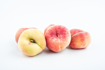 Fototapeta na wymiar Fresh fruit flat peach on white background