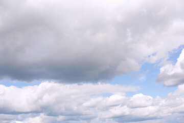 Gray clouds on blue sky background.