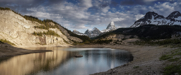 Beautiful Panoramic View of Og Lake in the Iconic Mt Assiniboine Provincial Park near Banff, Alberta, Canada. Canadian Mountain Landscape Background Panorama. Cloudy Sunset