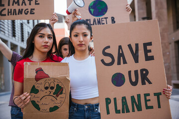Group of young people at a demonstration for the environment - Young millennials protest at a...