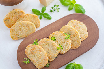 home made cheese crackers with herbs on a table