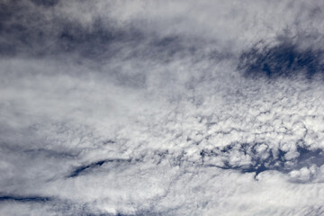 Obraz premium high Cumulus clouds against a dark blue sky