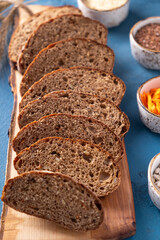 Carrot bread. Slices of fresh carrot bread on wooden board. Closeup